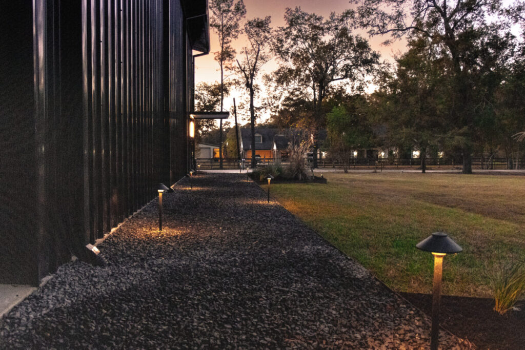 Houston Project - Acorn Ln - hardscaping, poured-in-place concrete pavers, black star gravel walkway, raised metal borders, artificial turf, low maintenance plants