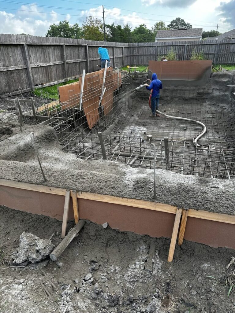 Mont Belvieu - Champions Gate - Geometric pool, raised spa, tanning ledge, water features - three scuppers and two bubblers, travertine coping, glass tile, pool table with travertine topper, raised backwall, spray decking, StoneScapes plaster