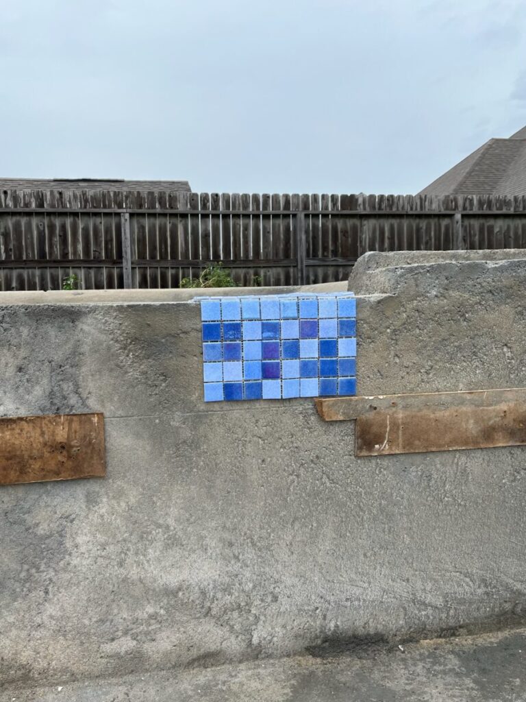 Mont Belvieu - Champions Gate - Geometric pool, raised spa, tanning ledge, water features - three scuppers and two bubblers, travertine coping, glass tile, pool table with travertine topper, raised backwall, spray decking, StoneScapes plaster