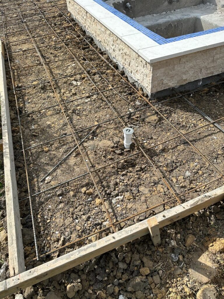 Mont Belvieu - Champions Gate - Geometric pool, raised spa, tanning ledge, water features - three scuppers and two bubblers, travertine coping, glass tile, pool table with travertine topper, raised backwall, spray decking, StoneScapes plaster