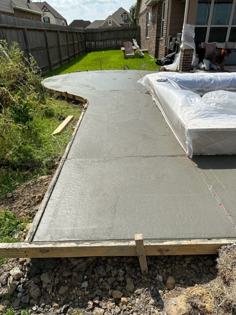 Mont Belvieu - Champions Gate - Geometric pool, raised spa, tanning ledge, water features - three scuppers and two bubblers, travertine coping, glass tile, pool table with travertine topper, raised backwall, spray decking, StoneScapes plaster
