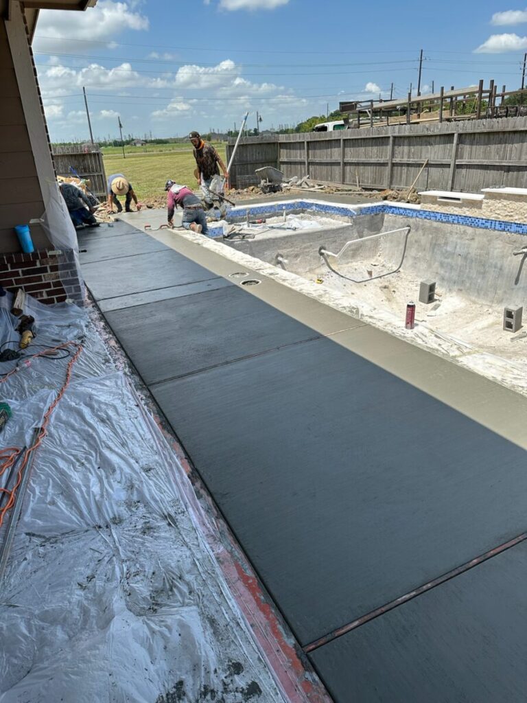 Mont Belvieu - Champions Gate - Geometric pool, raised spa, tanning ledge, water features - three scuppers and two bubblers, travertine coping, glass tile, pool table with travertine topper, raised backwall, spray decking, StoneScapes plaster
