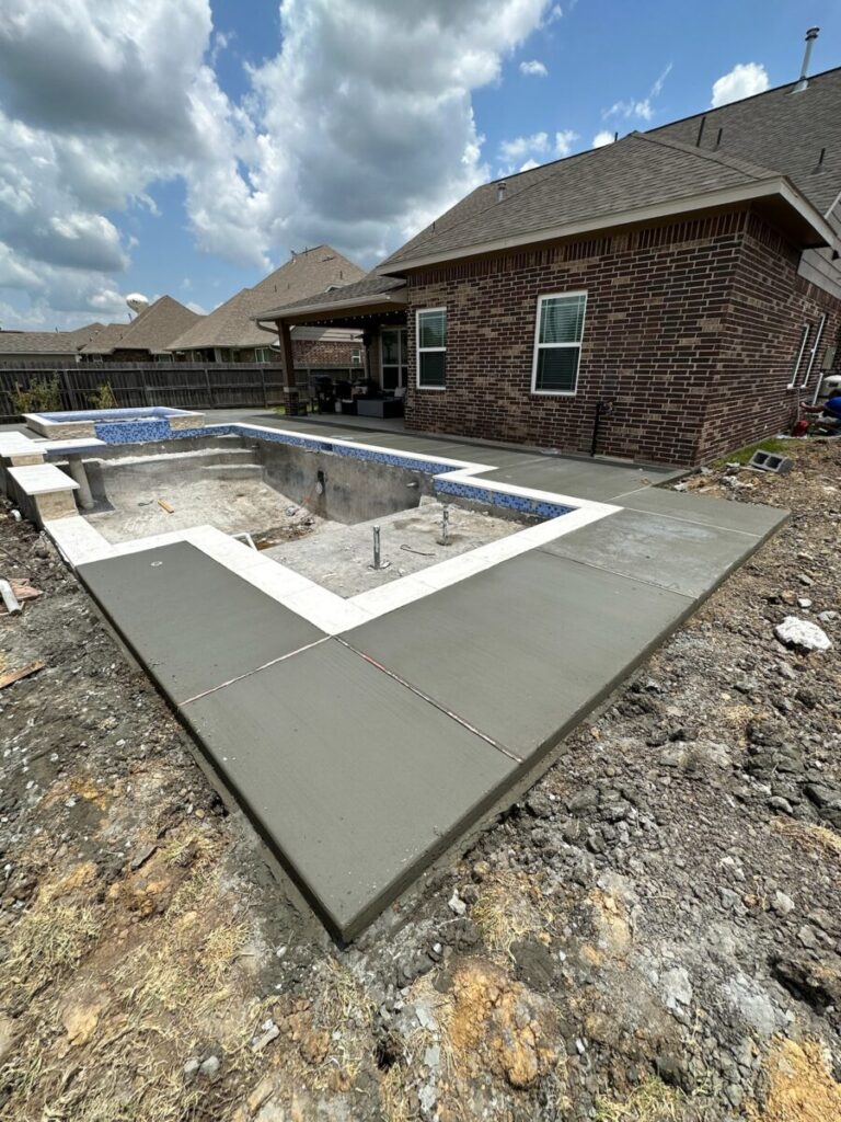 Mont Belvieu - Champions Gate - Geometric pool, raised spa, tanning ledge, water features - three scuppers and two bubblers, travertine coping, glass tile, pool table with travertine topper, raised backwall, spray decking, StoneScapes plaster