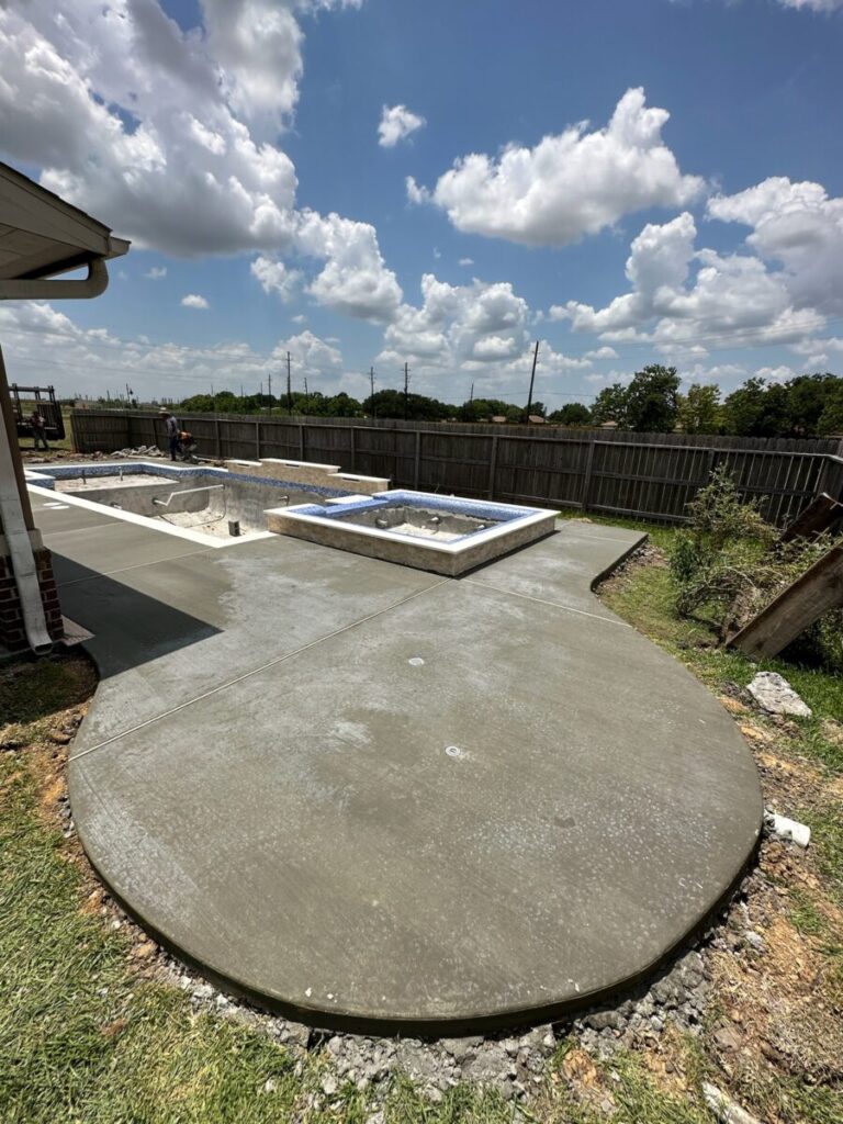 Mont Belvieu - Champions Gate - Geometric pool, raised spa, tanning ledge, water features - three scuppers and two bubblers, travertine coping, glass tile, pool table with travertine topper, raised backwall, spray decking, StoneScapes plaster