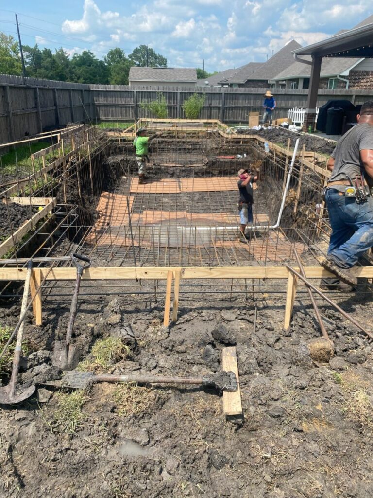 Mont Belvieu - Champions Gate - Geometric pool, raised spa, tanning ledge, water features - three scuppers and two bubblers, travertine coping, glass tile, pool table with travertine topper, raised backwall, spray decking, StoneScapes plaster