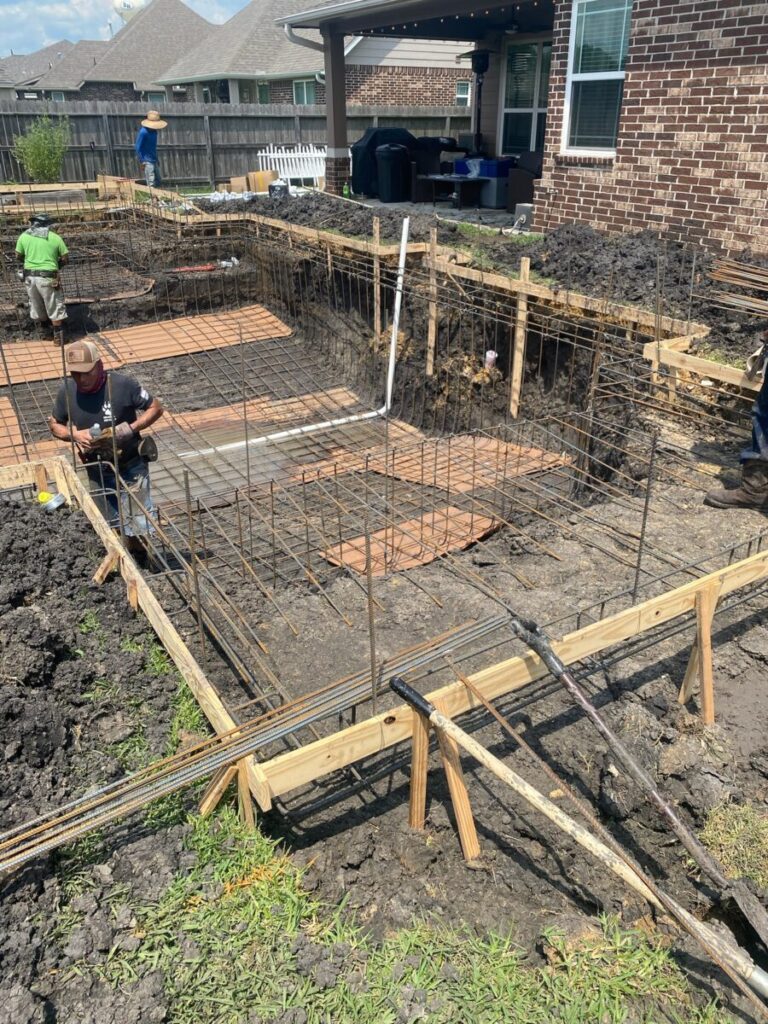 Mont Belvieu - Champions Gate - Geometric pool, raised spa, tanning ledge, water features - three scuppers and two bubblers, travertine coping, glass tile, pool table with travertine topper, raised backwall, spray decking, StoneScapes plaster