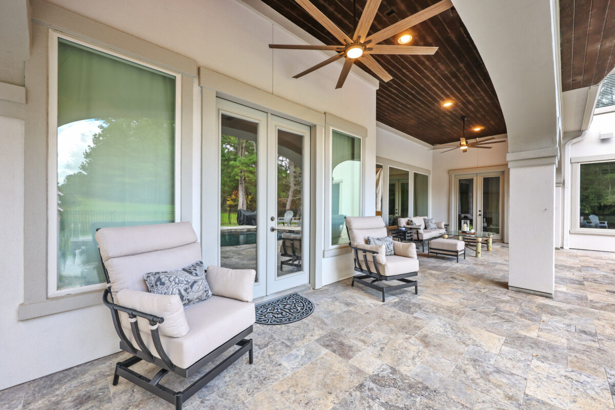 Patio Covers & Pergolas Magnolia Ranch Project - Roman-style pool with infinity edge spa, pillow-top edge, water features – three bubblers, six deck jets, French pattern travertine decking, chipping mat, artificial turf with putting green, accent boulders