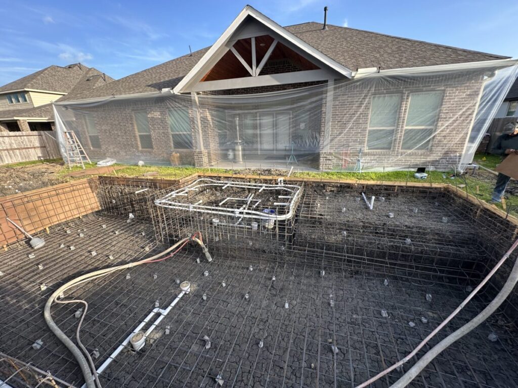 Cypress Project - Blue Wood - Geometric pool, tanning ledge, spa, safety railing, raised back wall, two fire bowls, one scupper, gas fire pit, multi-colored glass beads, travertine topper, split-face siding, glass tile, Arizona Sugar spray decking