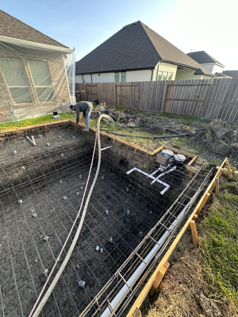 Cypress Project - Blue Wood - Geometric pool, tanning ledge, spa, safety railing, raised back wall, two fire bowls, one scupper, gas fire pit, multi-colored glass beads, travertine topper, split-face siding, glass tile, Arizona Sugar spray decking