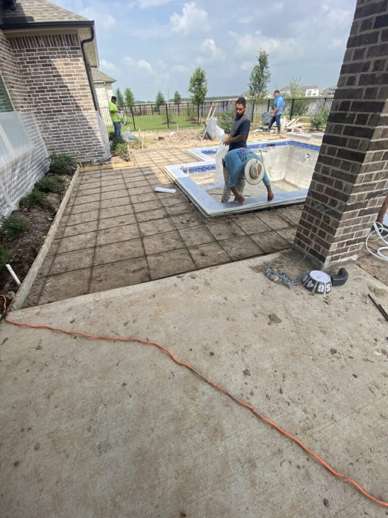 Cypress Project - Blue Wood - Geometric pool, tanning ledge, spa, safety railing, raised back wall, two fire bowls, one scupper, gas fire pit, multi-colored glass beads, travertine topper, split-face siding, glass tile, Arizona Sugar spray decking