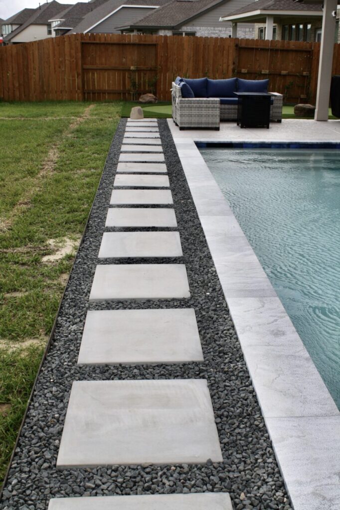 Texas Turf Tenders installed a geometric lap pool with a clean 6×6 tile finish. Spray decking offers a safe, polished surface, while a custom turf putting green finishes the minimal backyard makeover.