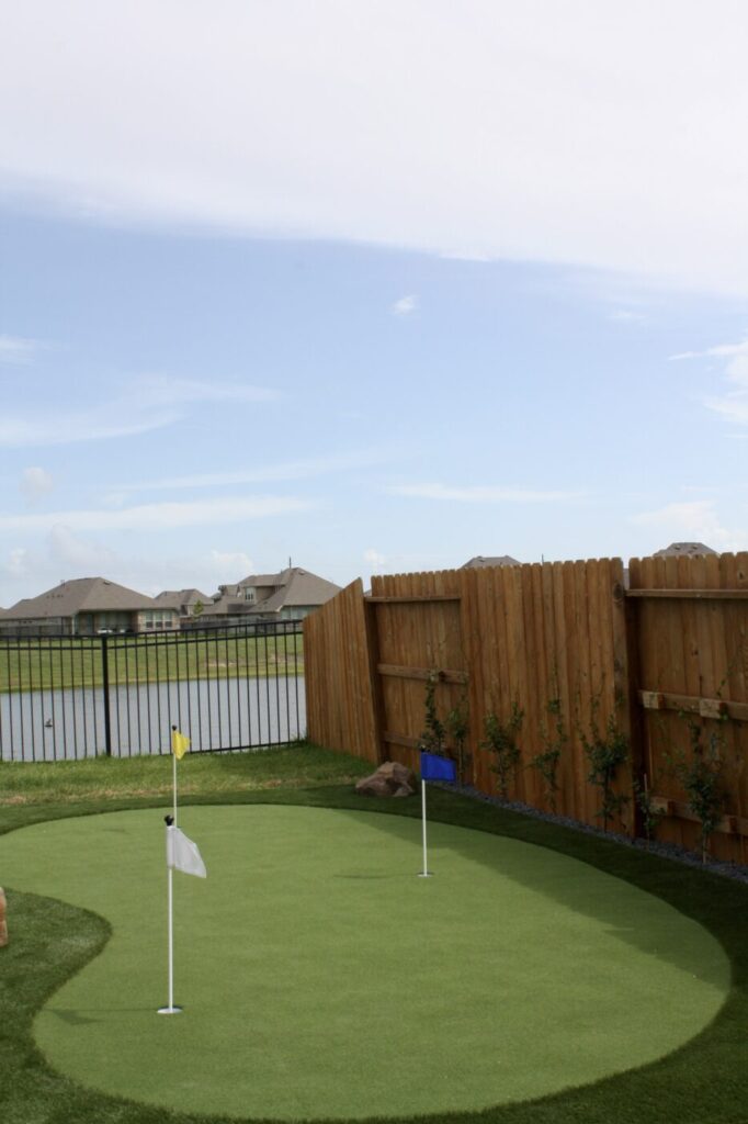 Texas Turf Tenders installed a geometric lap pool with a clean 6×6 tile finish. Spray decking offers a safe, polished surface, while a custom turf putting green finishes the minimal backyard makeover.