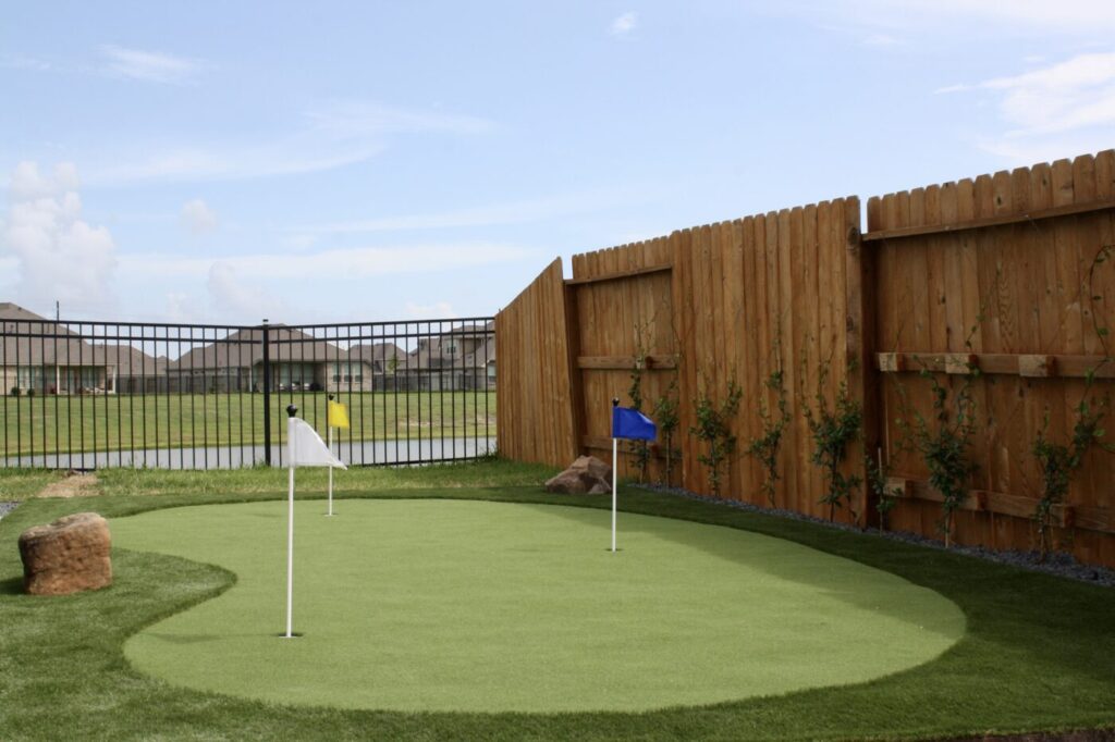 Texas Turf Tenders installed a geometric lap pool with a clean 6×6 tile finish. Spray decking offers a safe, polished surface, while a custom turf putting green finishes the minimal backyard makeover.